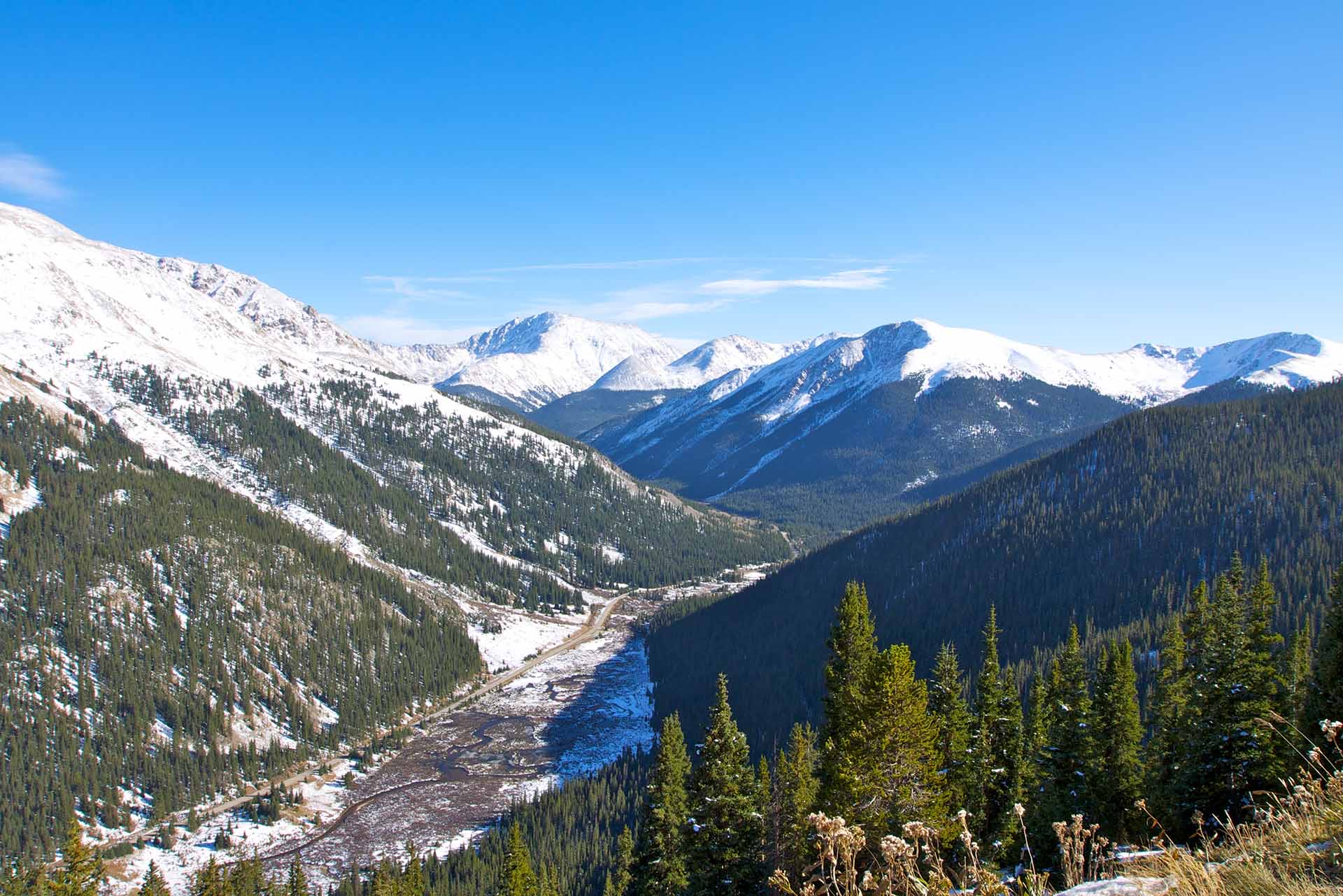A mountain valley below the snowy peaks at Independence Pass